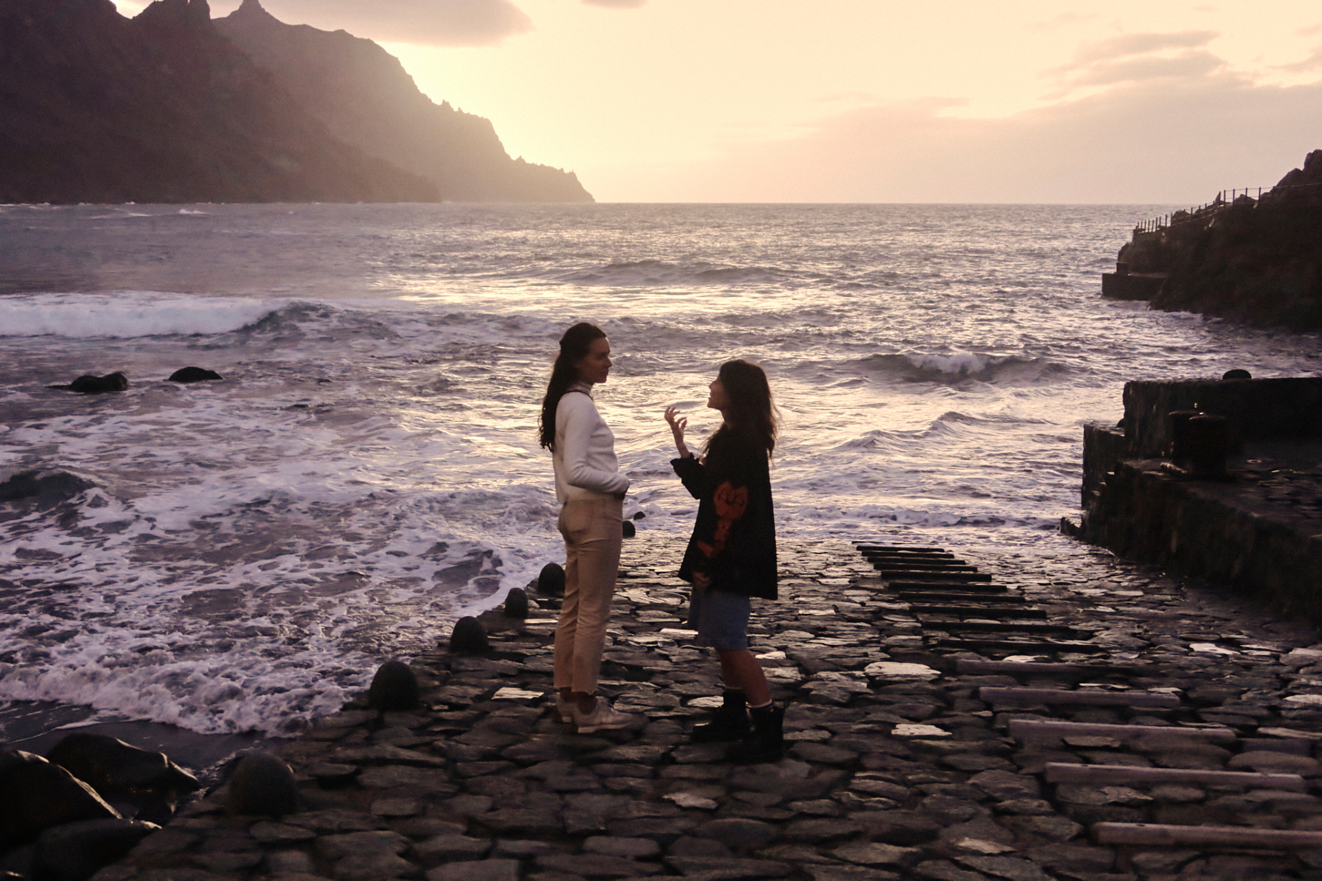Ocean sunset conversation by the shore